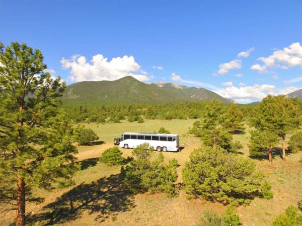 Missy Boondocking MCI 102 solar bus conversion coach forest colorado mountains