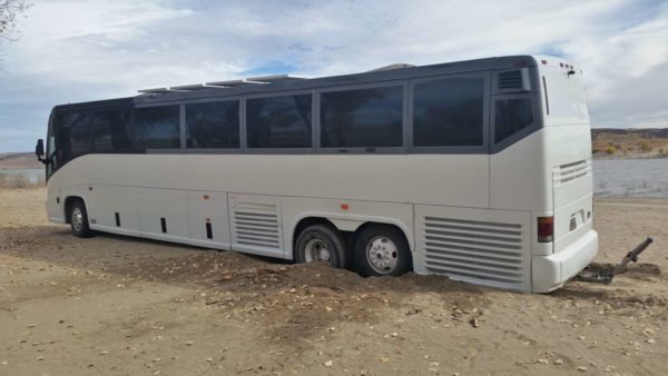 MCI 102 bus missy stuck sand tow truck