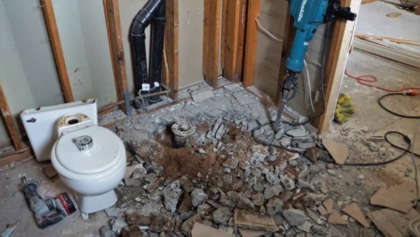 master bathroom remodel deconstruction removal tree roots toilet plumbing jack hammer concrete